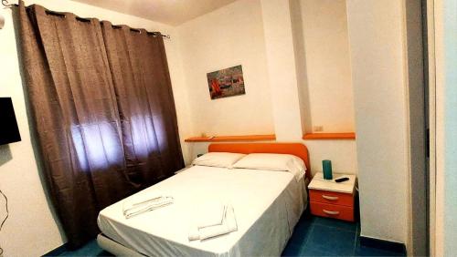 Postel nebo postele na pokoji v ubytování Home - Discover Cilento