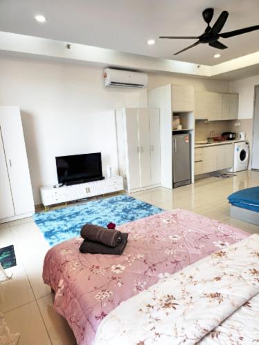 a large living room with a bed and a ceiling fan at I-City I-Residence BestStudio POLOS BASRI PROPERTI in Shah Alam