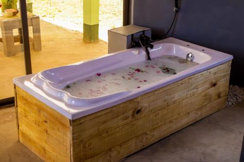 a bath tub filled with dirt in a room at Amboseli Amanya Lodge in Amboseli