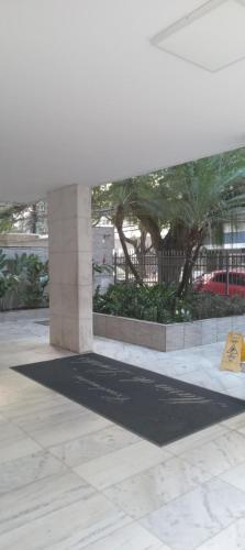 a yellow sign is on the floor of a building at Luz de Regina Hospedagem in Salvador