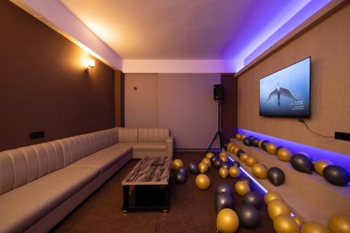 a room with a couch and a bunch of balloons at The Layover Hotel in Dimapur