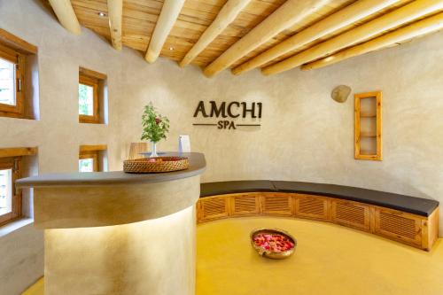 a room with a counter and a pizza on the floor at Organic Village Retreat in Hundar
