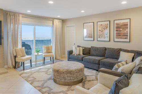 a living room with a couch and a table at LUX Retreat - Best Views - All Amenities - Central in Lomita