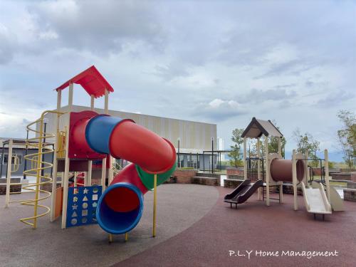 a playground with a slide and a slide at Muji Ipoh Falim Free Parking & Free Netflix in Ipoh