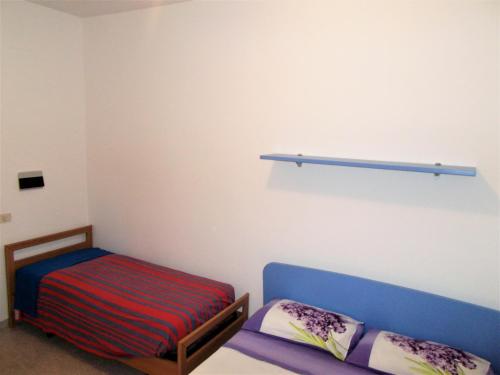 Postel nebo postele na pokoji v ubytování Home - Discover Cilento