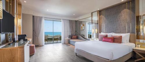En eller flere senge i et værelse på Ela Excellence Resort Belek