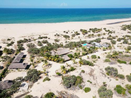 an aerial view of a resort on the beach at Sunset Villa - Beachfront Villa with Private Pool by Karula in Cabo Nhamua