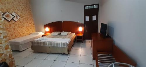 Postel nebo postele na pokoji v ubytování Hotel São Francisco