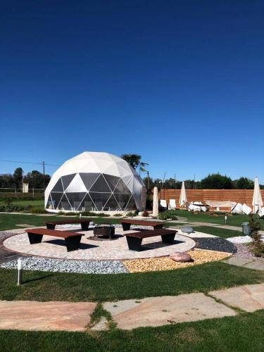 a tent in a park with a picnic table at Green Village - Sirenetta in Savigliano