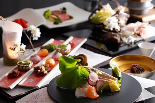 a table with several plates of food on it at Ichiboukan Hanare Kai in Kyotango