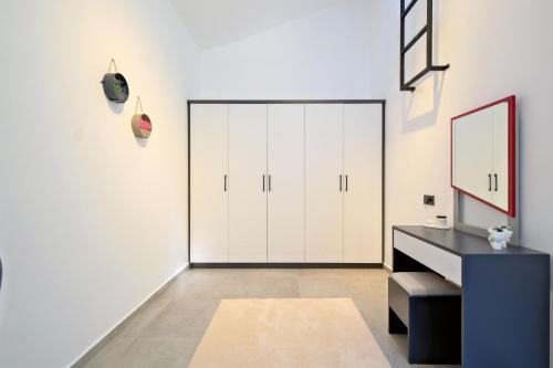 a room with white walls and a large closet at Villa Montana 1 in Fethiye