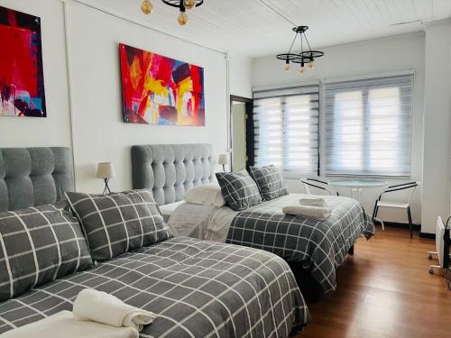 Postel nebo postele na pokoji v ubytování Hotel Nomada Osorno