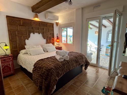 a bedroom with a bed with a large wooden headboard at Hotel Altea Paradise 1917 - Adults Only in Altea