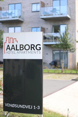 a sign in front of a building at Aalborg Hotel Apartments in Aalborg
