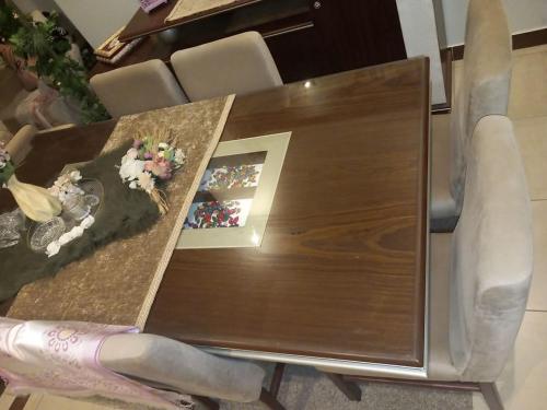 a wooden table with a cake on top of it at العاصمة الإدارية in Cairo