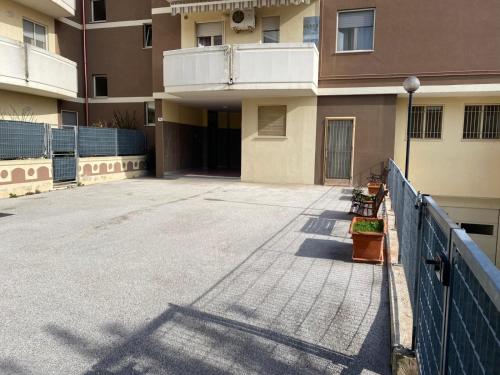 an empty parking lot in front of a building at Casa Sofia in Termoli
