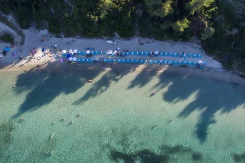 an aerial view of a beach with people in the water at Four Seasons - The White Queen House in Kriopigi