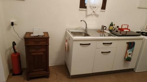 a kitchen with a sink and a counter top at A Kasuzza in Pantelleria