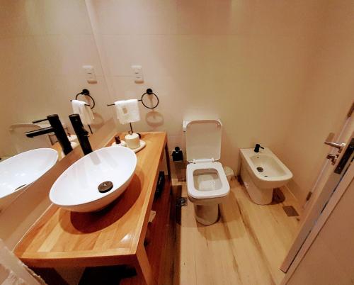 a bathroom with a sink and a toilet at Ap 208 Experimenta los mágicos Atardeceres y las vistas in Colonia del Sacramento