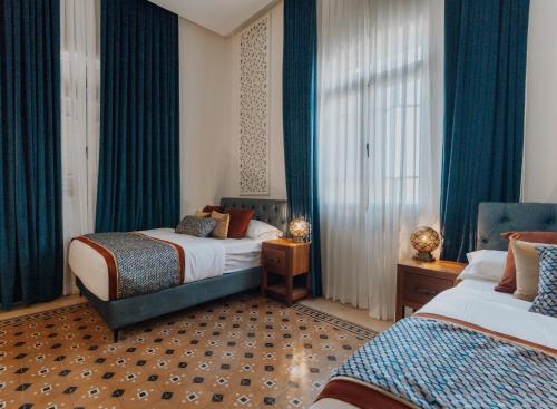 Ένα ή περισσότερα κρεβάτια σε δωμάτιο στο Oasis Palace