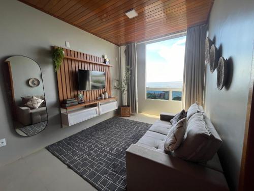 En eller flere senge i et værelse på Apartamento Sapucaia 42125