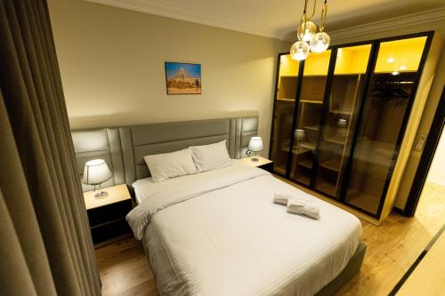 Ένα ή περισσότερα κρεβάτια σε δωμάτιο στο Airport apartments Elite service