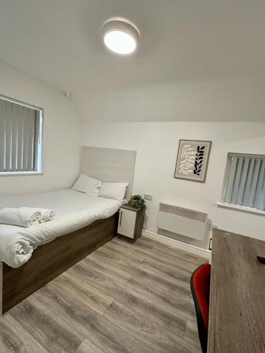 Ένα ή περισσότερα κρεβάτια σε δωμάτιο στο Lancaster Apartment