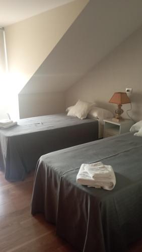 Ένα ή περισσότερα κρεβάτια σε δωμάτιο στο Apartamentos Dunamar
