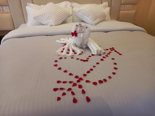 Katil atau katil-katil dalam bilik di Olempiaus Gardens Hotel