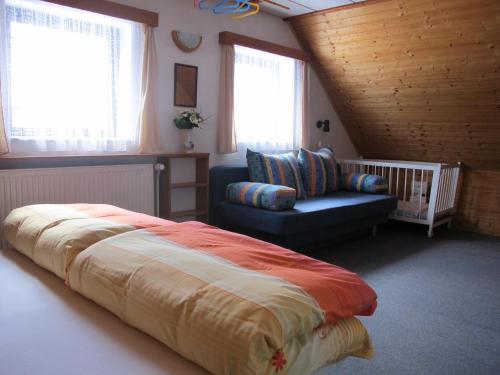 A bed or beds in a room at Guest House U Lakomce