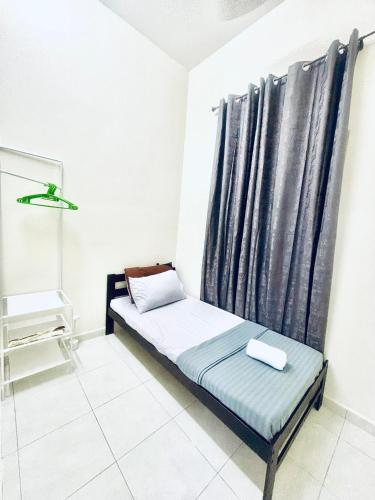 Ένα ή περισσότερα κρεβάτια σε δωμάτιο στο H&Z Guesthouse Kulim Hi-Tech - Free Wifi - Netflix