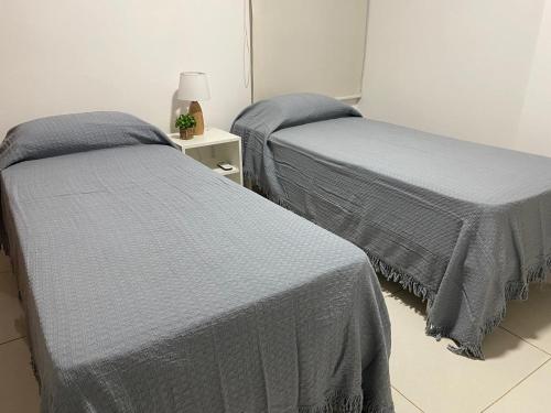 two beds sitting next to each other in a room at Dpto 9 DE JULIO in Villa María