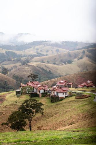 a group of houses on top of a hill at Lavandas de Cunha Pousada Boutique in Cunha