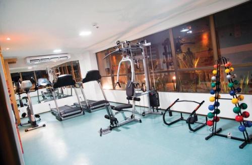 a gym with several exercise equipment in a room at Flats no Ritz Suítes in Maceió