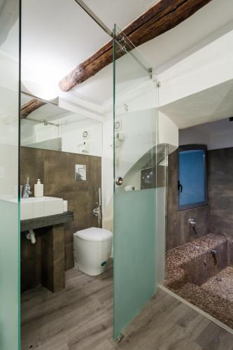 a bathroom with a glass shower and a sink at WELLNESS HM wellness home By Dimorra in Naples