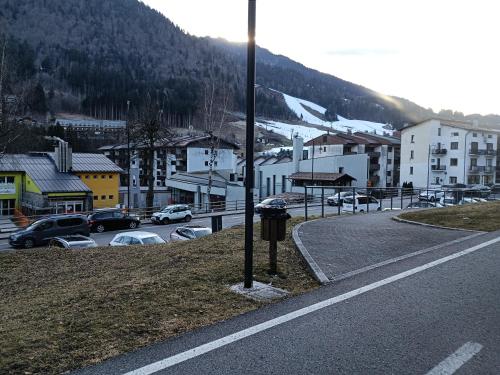 a street with cars parked on the side of a road at Central Greenlife in Tarvisio
