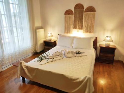 Ένα ή περισσότερα κρεβάτια σε δωμάτιο στο Villa Karidia