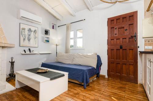 Ένα ή περισσότερα κρεβάτια σε δωμάτιο στο YourHouse Can Gancho Villa