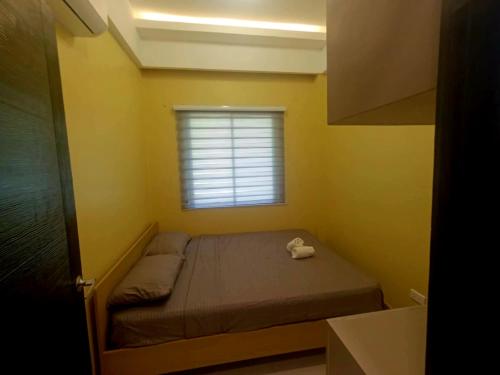 Ένα ή περισσότερα κρεβάτια σε δωμάτιο στο Manu-Manu Homestay