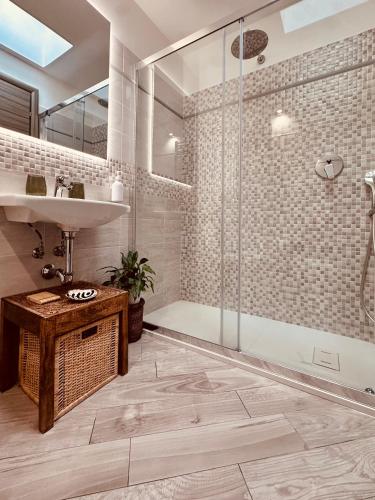 a bathroom with a shower and a sink at CASA MIRA luxury sea house fco airport in Fiumicino