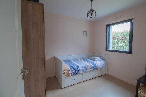 Ein Bett oder Betten in einem Zimmer der Unterkunft La Houlette