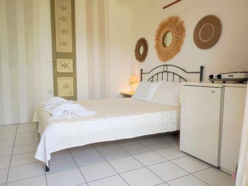 Ένα ή περισσότερα κρεβάτια σε δωμάτιο στο Villa Karidia