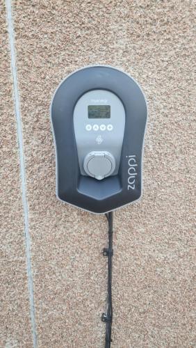 a pay phone is sitting on the ground at Room on the River in Cruden Bay