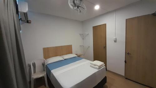 Una cama o camas en una habitación de Panamerican Hostel