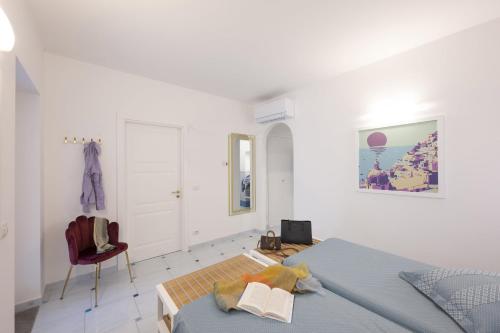 Ένα ή περισσότερα κρεβάτια σε δωμάτιο στο Cento Serenate Amalfi