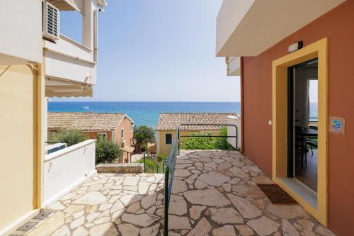 a balcony with a view of the ocean at Coastal Bliss Apartments in Glyfada