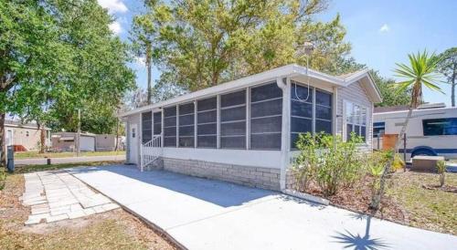 a white house with a lot of windows at Amazing 1 bedroom Near Disney in Seven Points