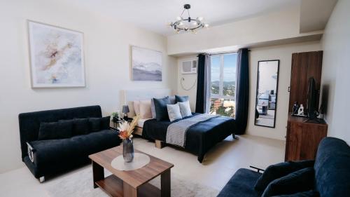 Ένα ή περισσότερα κρεβάτια σε δωμάτιο στο Avida Riala in the Centre of IT Park