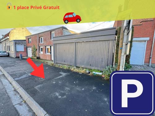 a car parked in a parking lot next to a fence at Suite Romantique - Balneo Privé - Parking in Douai