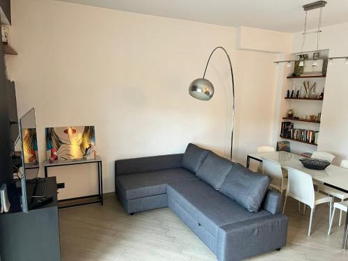 a living room with a couch and a table at La casa di Andrea in Messina